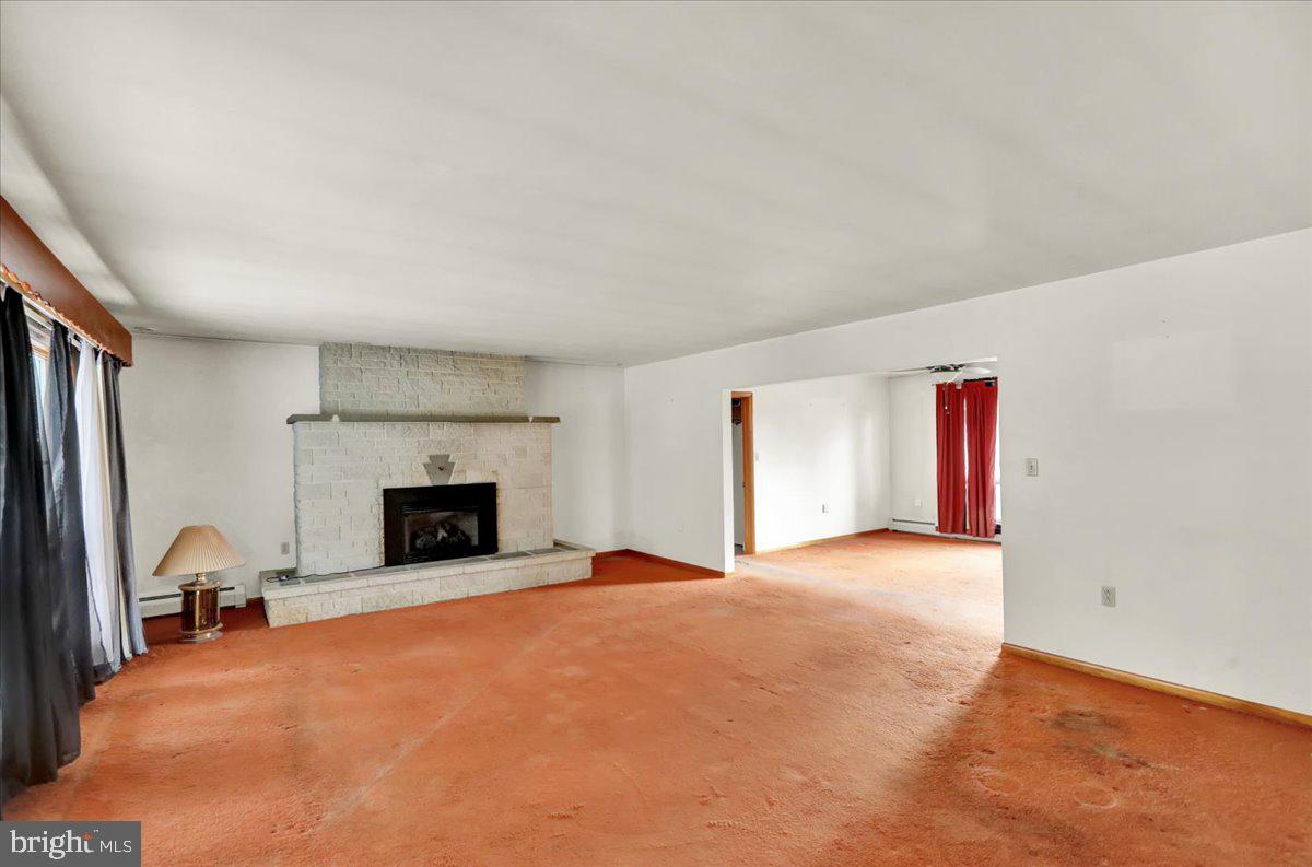 508 American Legion Boulevard Pine Grove, PA 17963 - Photo 17 of 40 a view of an empty room with a fireplace and a window