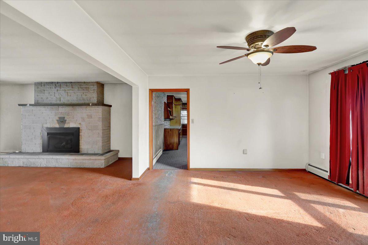 508 American Legion Boulevard Pine Grove, PA 17963 - Photo 21 of 40 an empty room with closet and a fireplace
