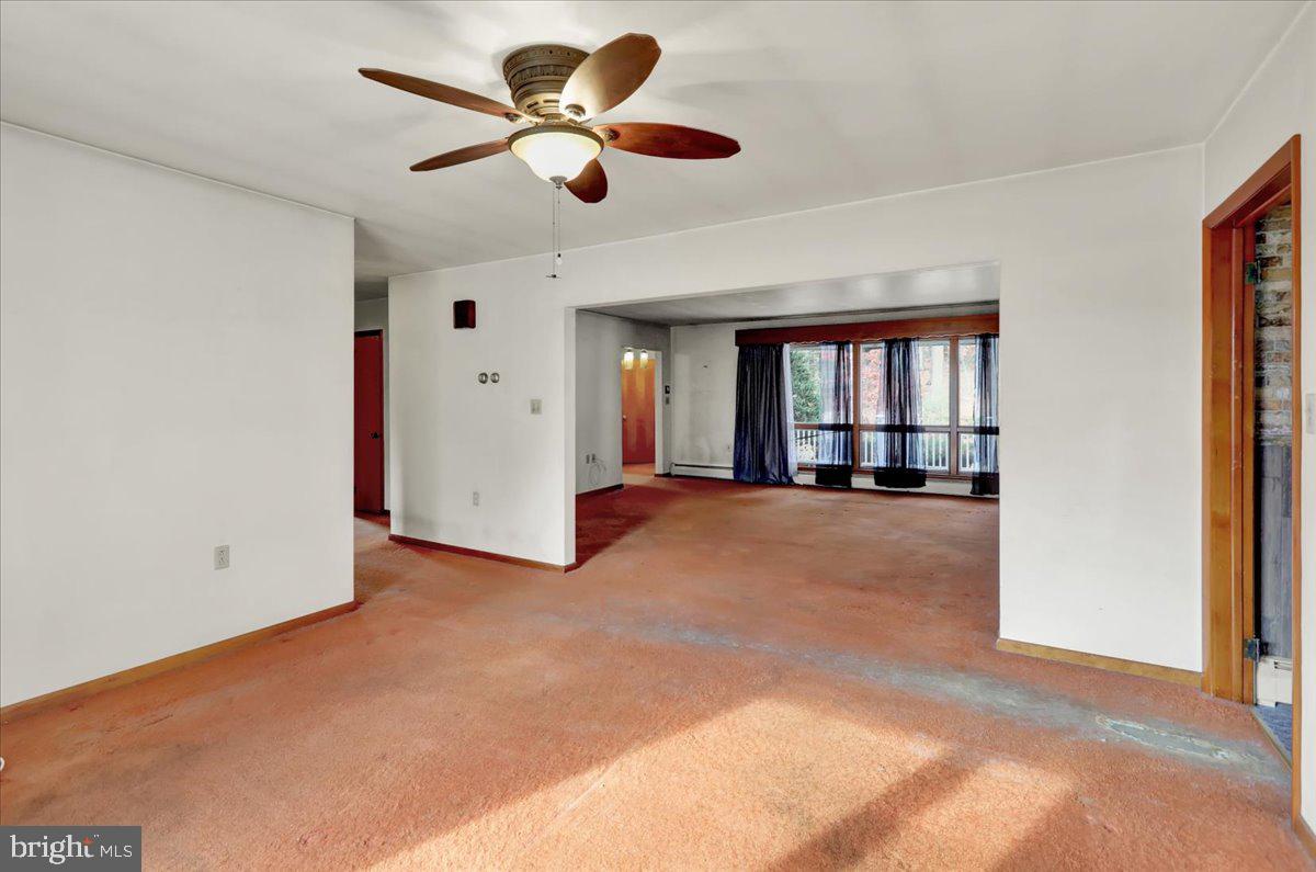 508 American Legion Boulevard Pine Grove, PA 17963 - Photo 22 of 40 a view of a livingroom with a ceiling fan and window