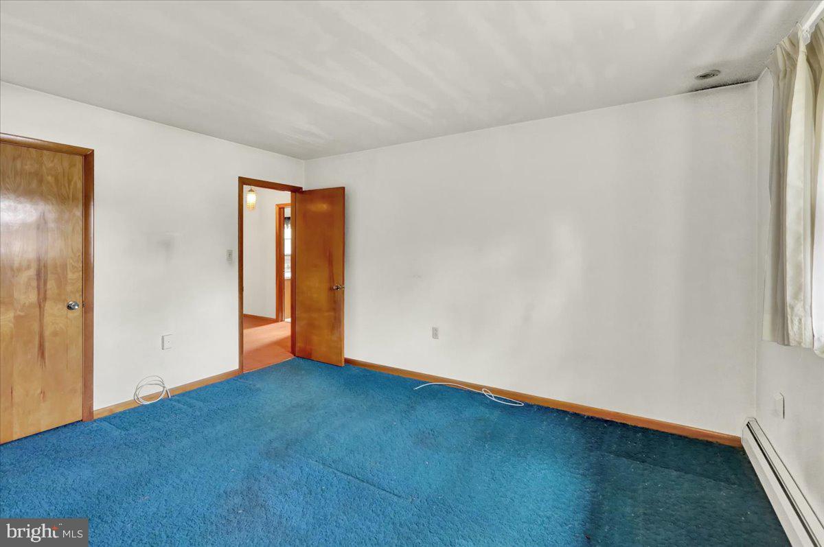 508 American Legion Boulevard Pine Grove, PA 17963 - Photo 30 of 40 a view of an empty room with wooden floor and a window