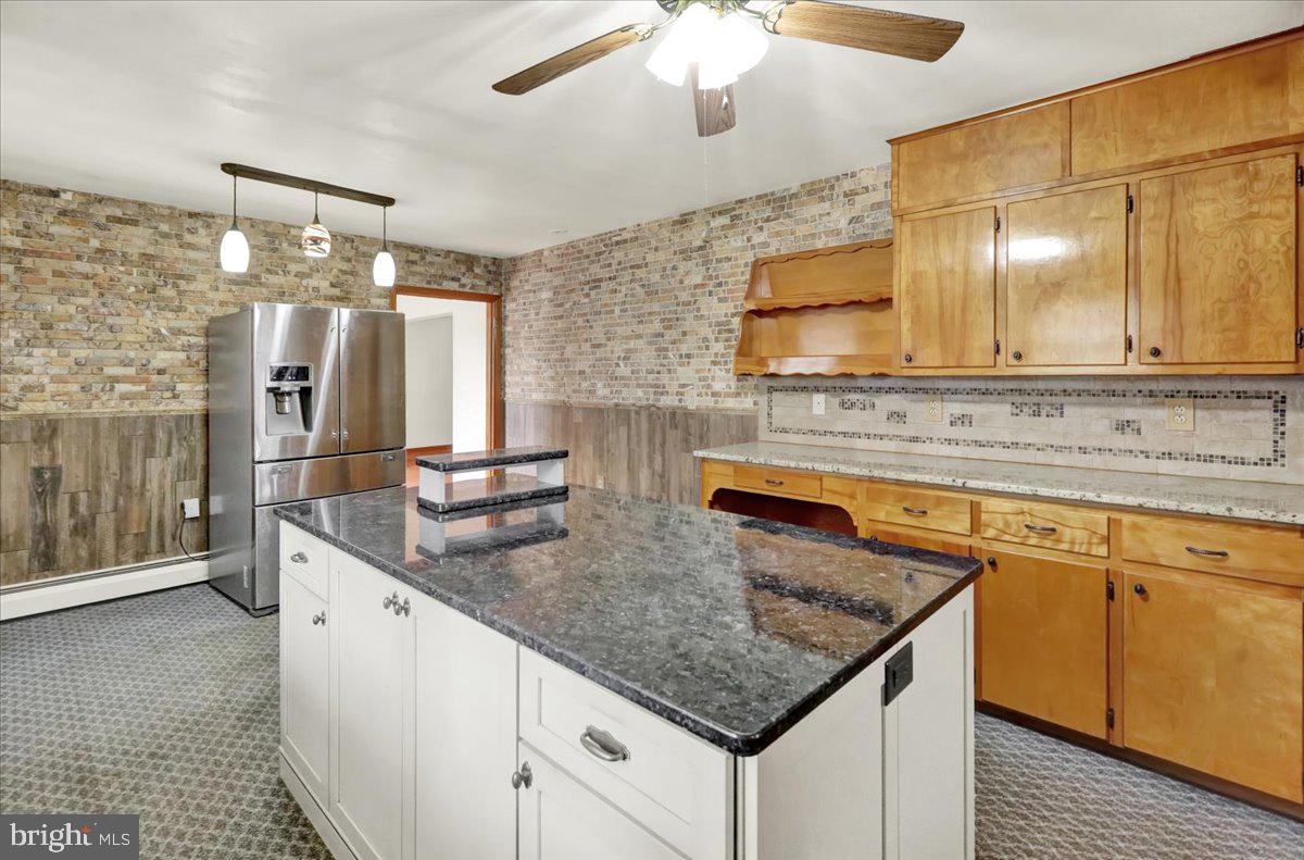 508 American Legion Boulevard Pine Grove, PA 17963 - Photo 7 of 40 a kitchen with stainless steel appliances granite countertop a sink stove and cabinets