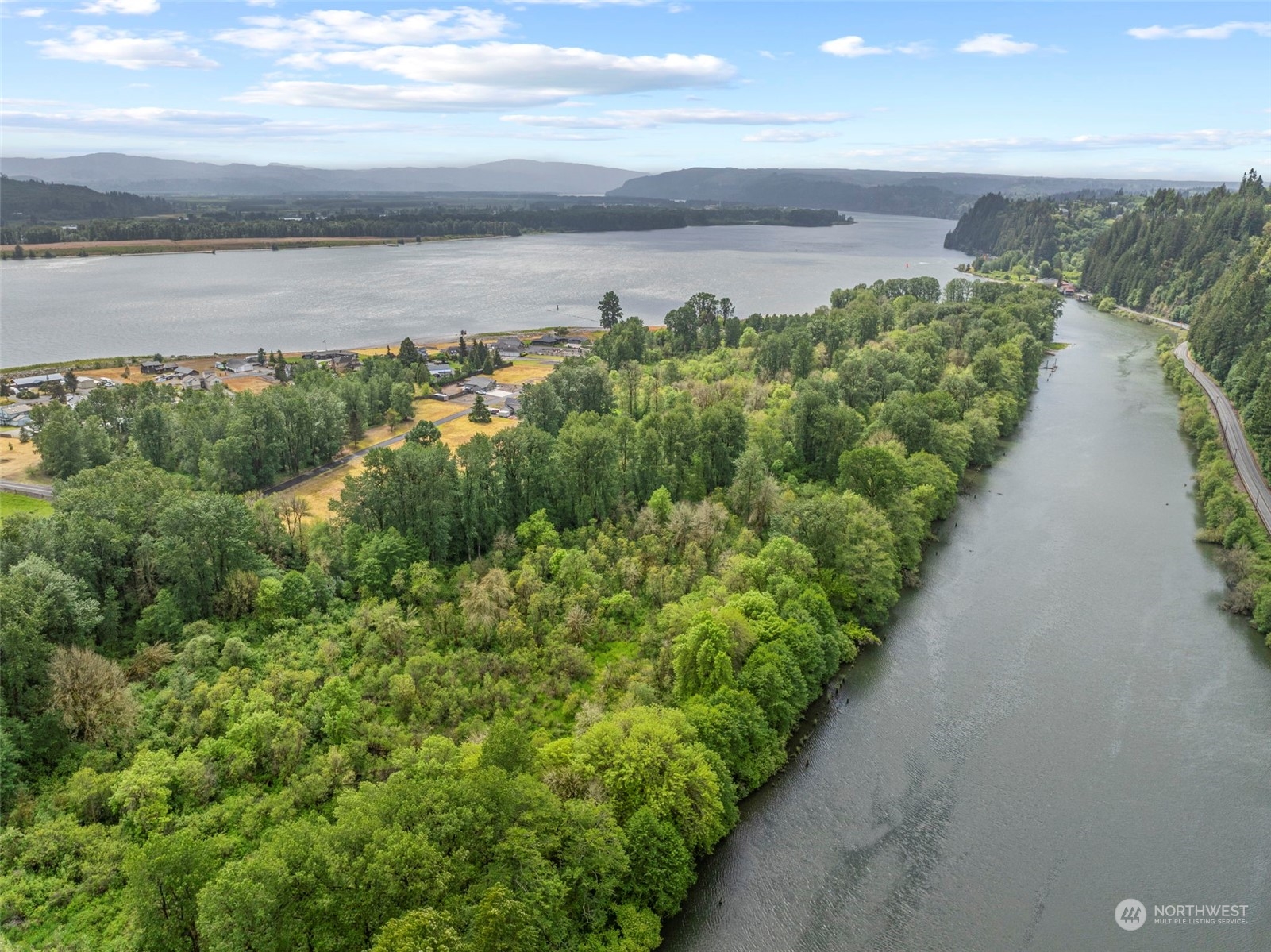 1 Columbia Point Road Longview, WA 98632 - Photo 5 of 7 a view of a lake with beach and outdoor space