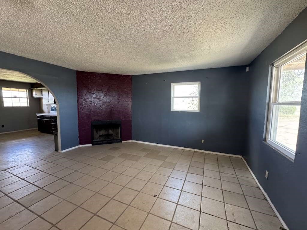 2605 East 19th Street Lubbock, TX 79403 - Photo 3 of 10 an empty room with windows