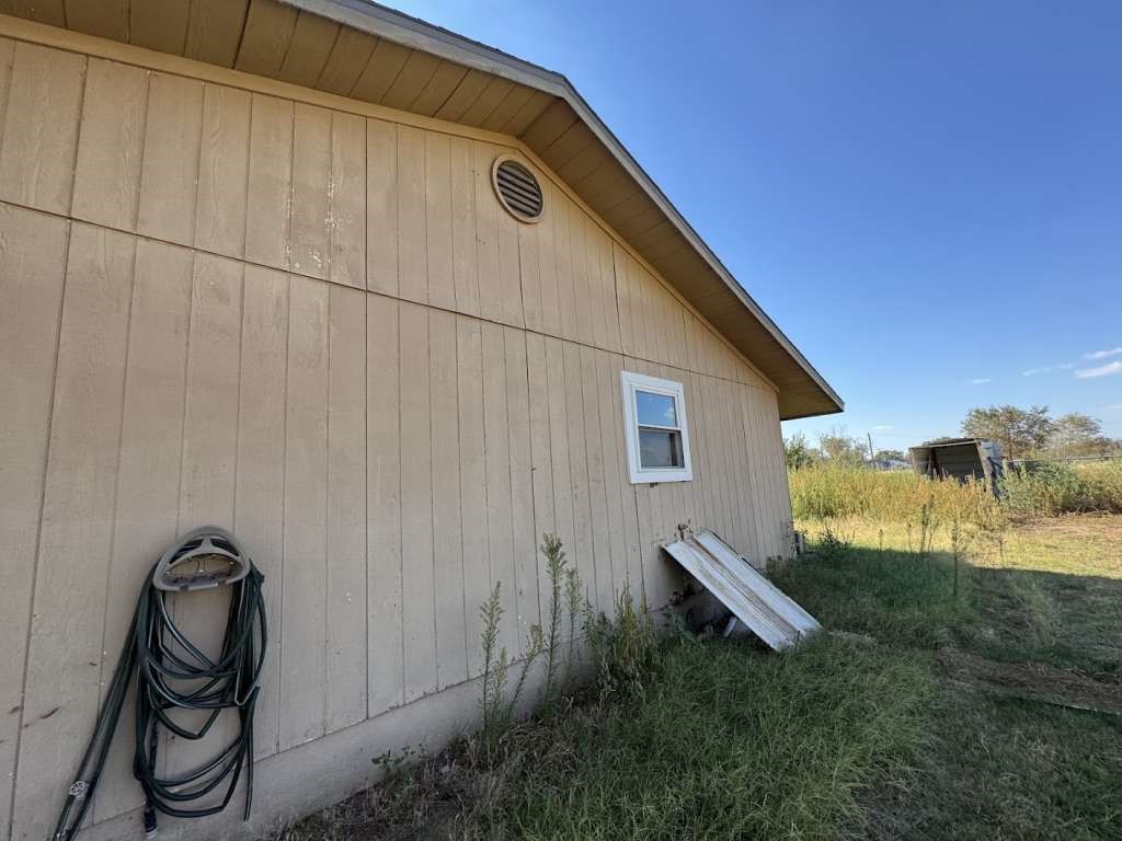 2605 East 19th Street Lubbock, TX 79403 - Photo 10 of 10 a backyard of a house with table and chairs