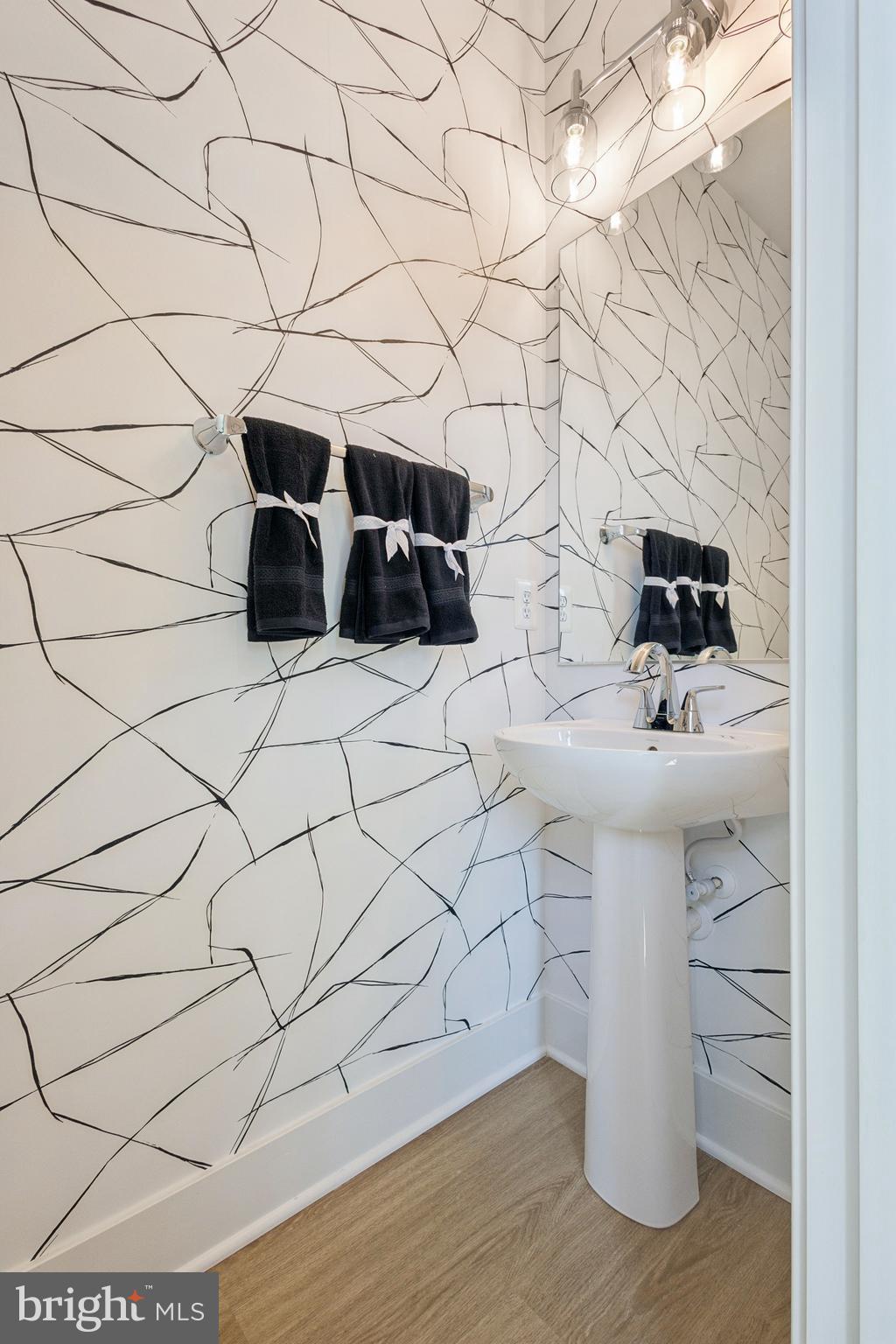 13740 Cobble Loop Woodbridge, VA 22193 - Photo 10 of 28 a bathroom with a sink and a mirror