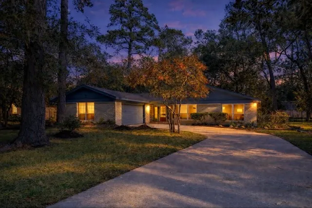a house view with a sitting space and garden