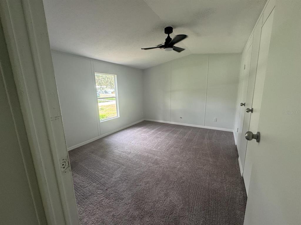 9053 Bourbon Street New Port Richey, FL 34654 - Photo 15 of 27 a view of empty room with windows