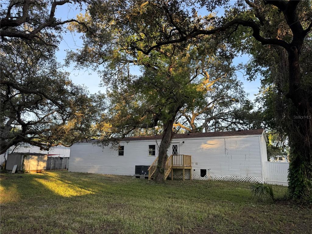 9053 Bourbon Street New Port Richey, FL 34654 - Photo 19 of 27 a view of a house with a yard