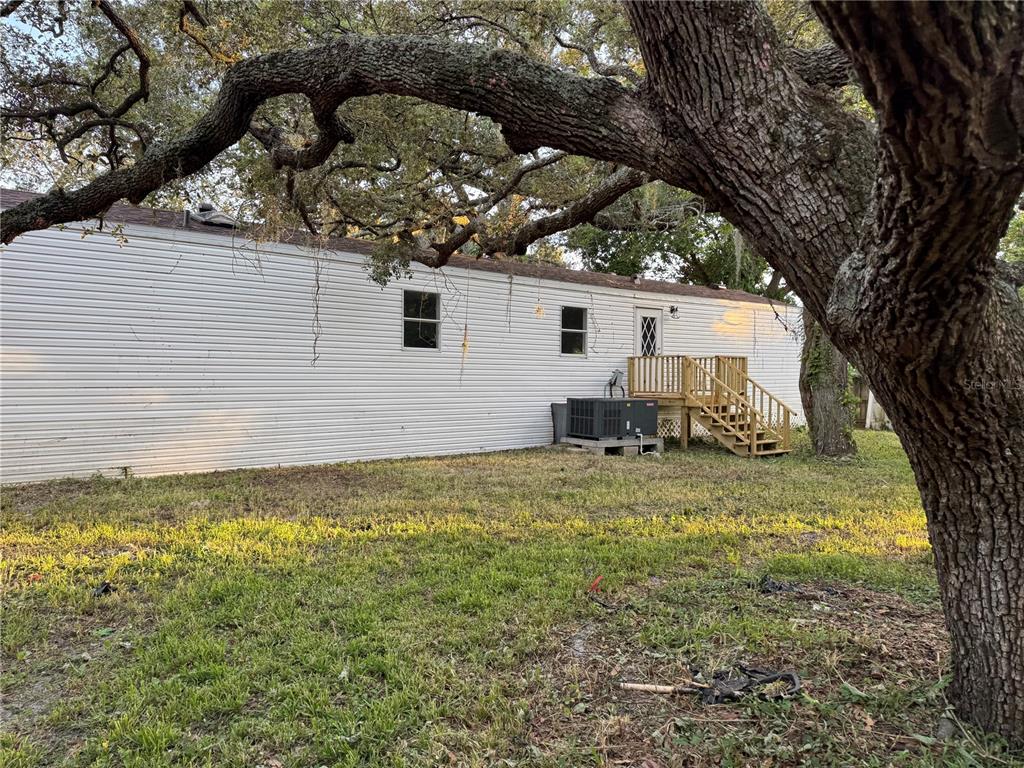 9053 Bourbon Street New Port Richey, FL 34654 - Photo 24 of 27 a house view with a garden space
