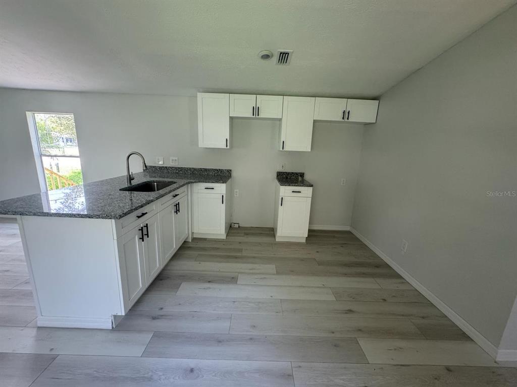 9053 Bourbon Street New Port Richey, FL 34654 - Photo 8 of 27 a view of a kitchen with a sink