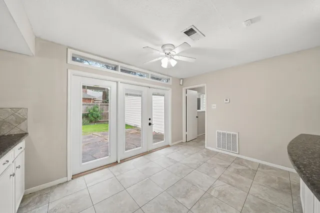 a view of an empty room with a bathroom