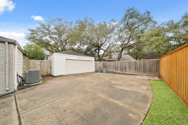 a view of backyard and tree