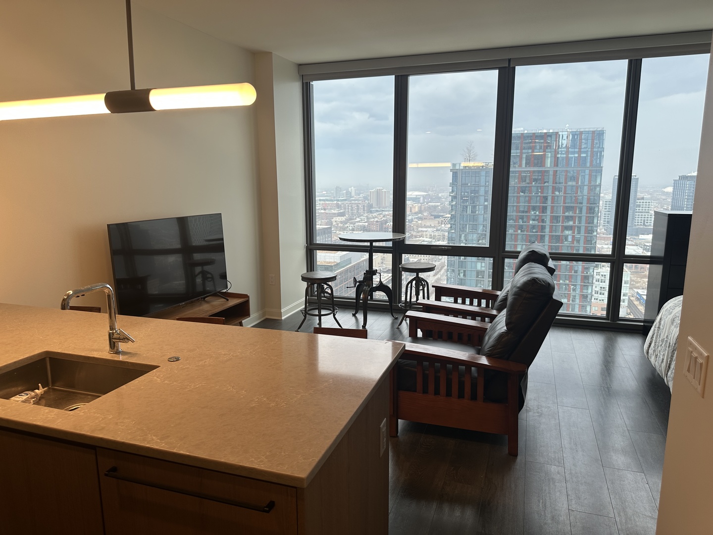 164 North Peoria Street, Unit 2801 Chicago, IL 60607 - Photo 11 of 16 a dining room with furniture and wooden floor