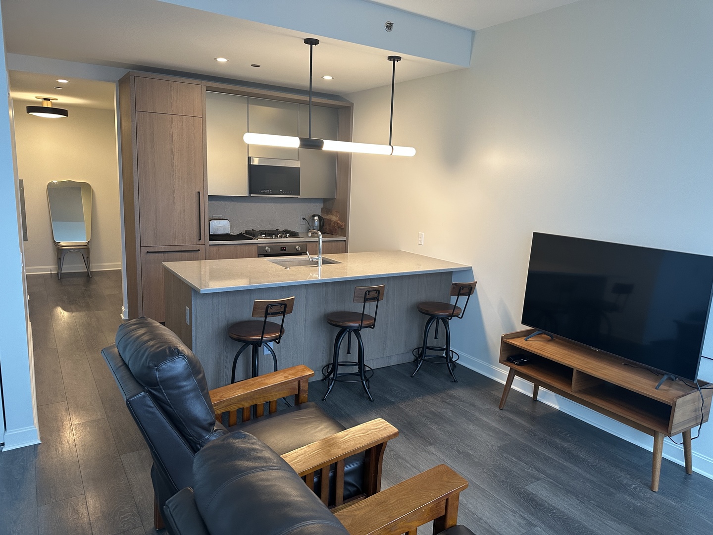 164 North Peoria Street, Unit 2801 Chicago, IL 60607 - Photo 12 of 16 a living room with furniture and a flat screen tv