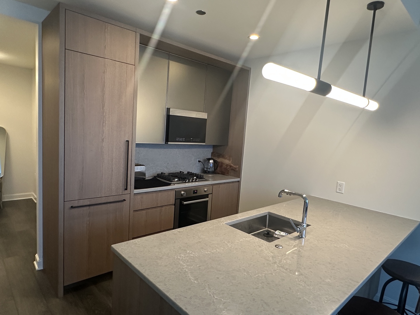 164 North Peoria Street, Unit 2801 Chicago, IL 60607 - Photo 13 of 16 a kitchen with a appliances a sink and a refrigerator