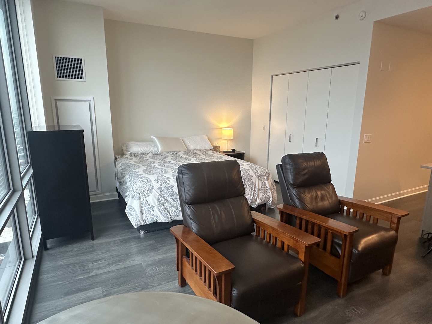 164 North Peoria Street, Unit 2801 Chicago, IL 60607 - Photo 14 of 16 a living room with furniture and a flat screen tv