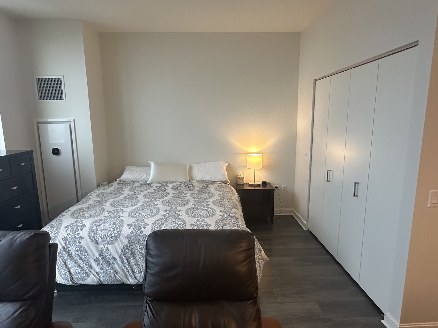 164 North Peoria Street, Unit 2801 Chicago, IL 60607 - Photo 16 of 16 a bedroom with a bed and a lamp