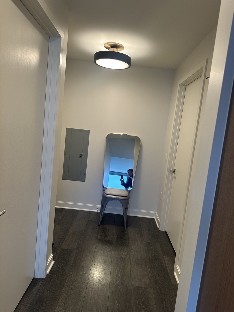 164 North Peoria Street, Unit 2801 Chicago, IL 60607 - Photo 10 of 16 an empty room with wooden floor and windows
