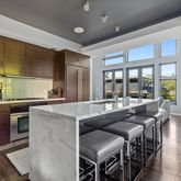 a open kitchen with stainless steel appliances granite countertop a sink and cabinets