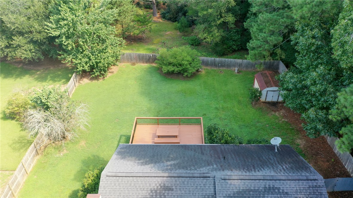 117 Shaftsbury Road Clemson, SC 29631 - Photo 25 of 29 Mature trees frame a spacious lawn and wooden deck behind the home.