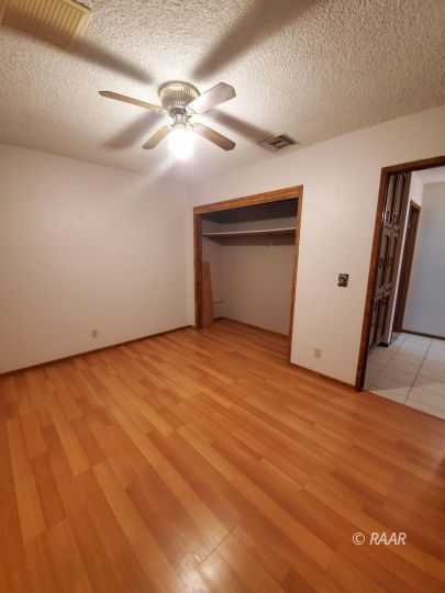 342 East Wilson Avenue Ridgecrest, CA 93555 - Photo 19 of 27 a view of an empty room with a chandelier fan