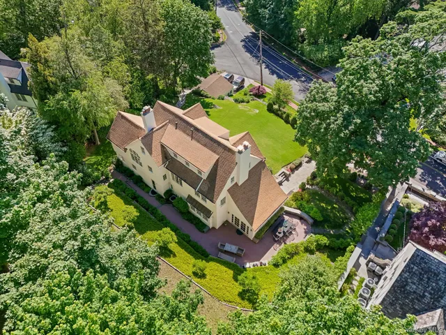 an aerial view of a house with a garden