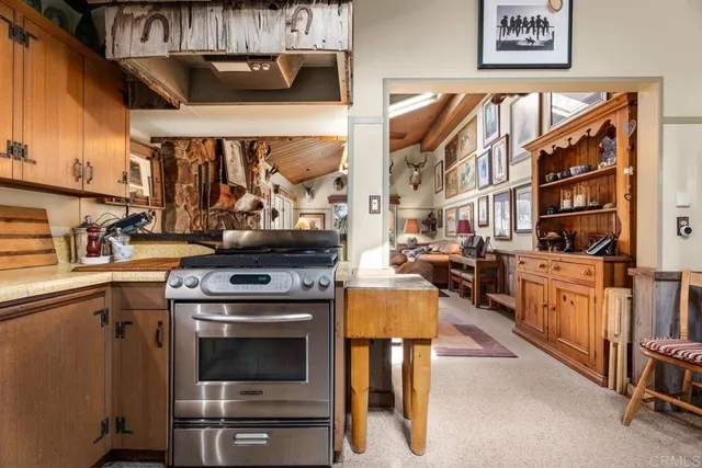 a kitchen with stainless steel appliances granite countertop a stove and a sink