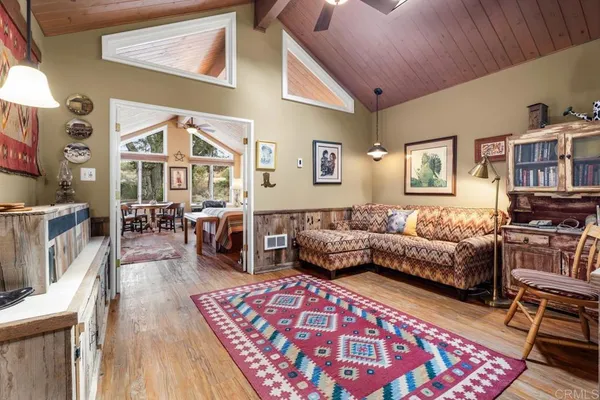 a living room with furniture and a rug