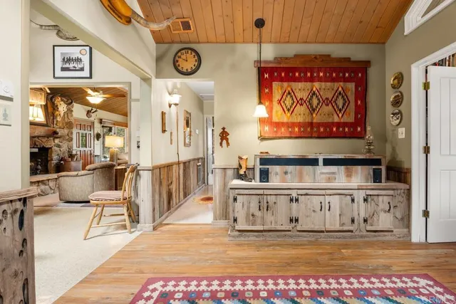 a view of a room with wooden floor and windows