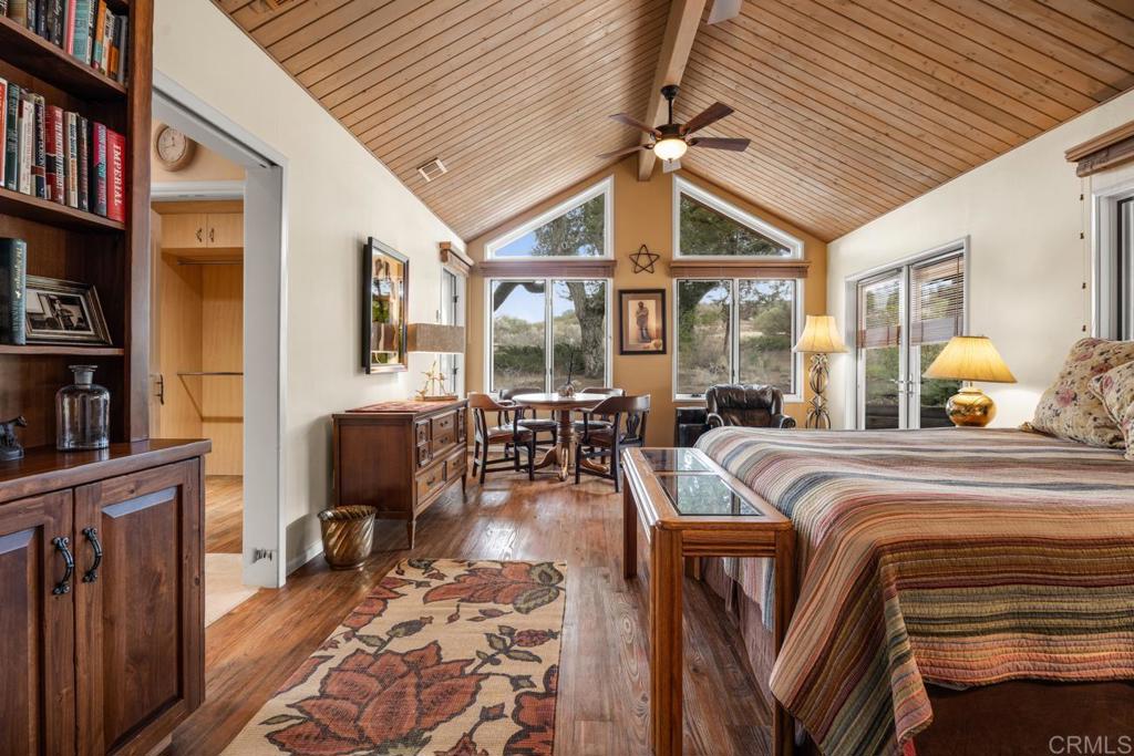 1088 Shasta Way Boulevard, CA 91905 - Photo 15 of 47 a spacious bedroom with a bed a bookshelf and a bookshelf