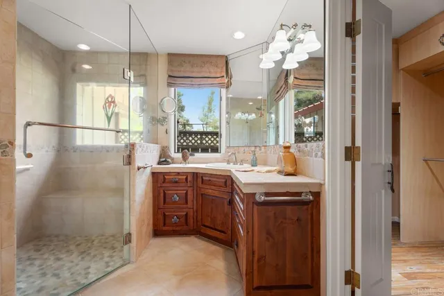 a bathroom with a bathtub and a shower