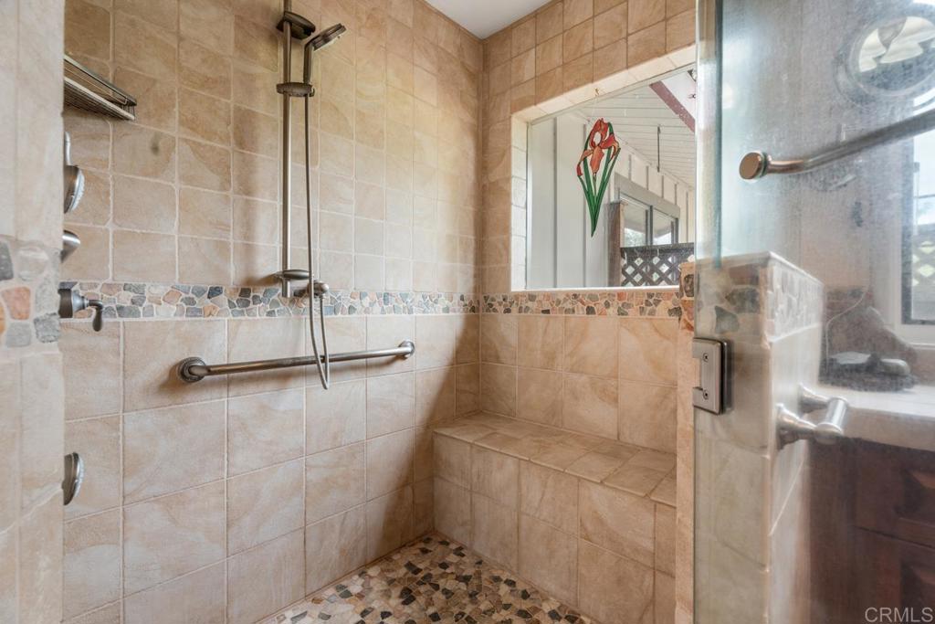 1088 Shasta Way Boulevard, CA 91905 - Photo 20 of 47 a bathroom with a bathtub and a shower
