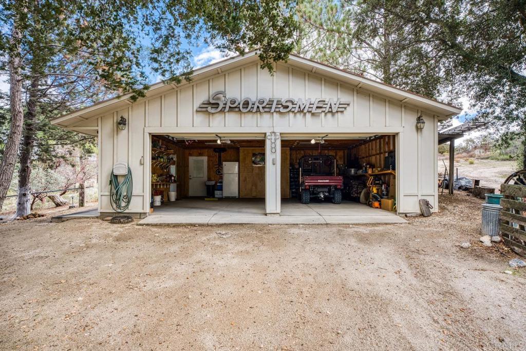 1088 Shasta Way Boulevard, CA 91905 - Photo 33 of 47 a front view of a house with a yard and garage