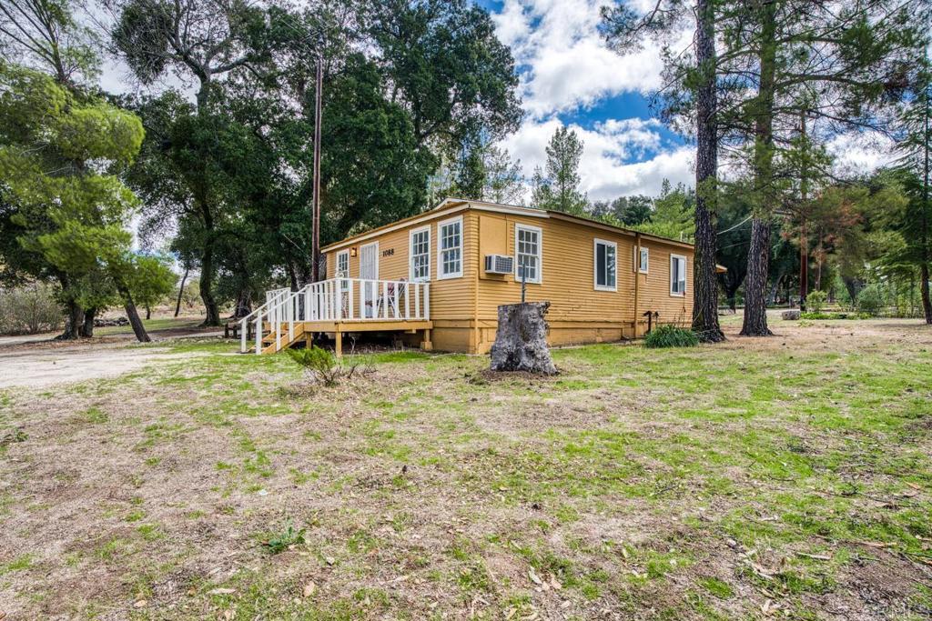 1088 Shasta Way Boulevard, CA 91905 - Photo 37 of 47 a front view of a house with a yard