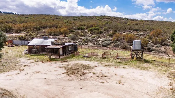 an aerial view of house with yard