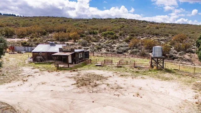 an aerial view of house with yard