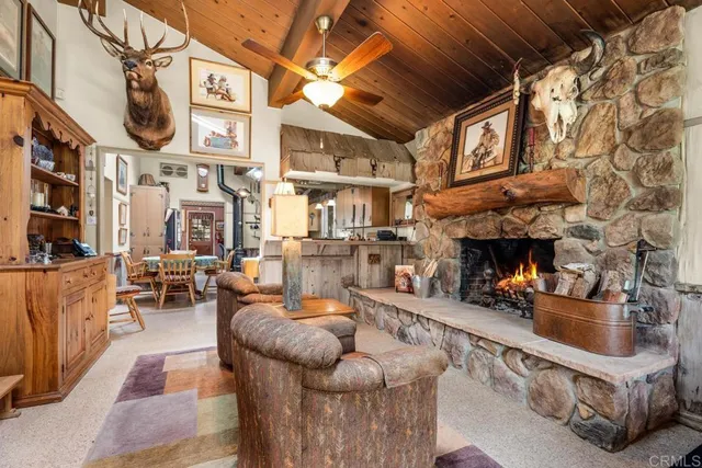 a outdoor living space with patio furniture and a fireplace