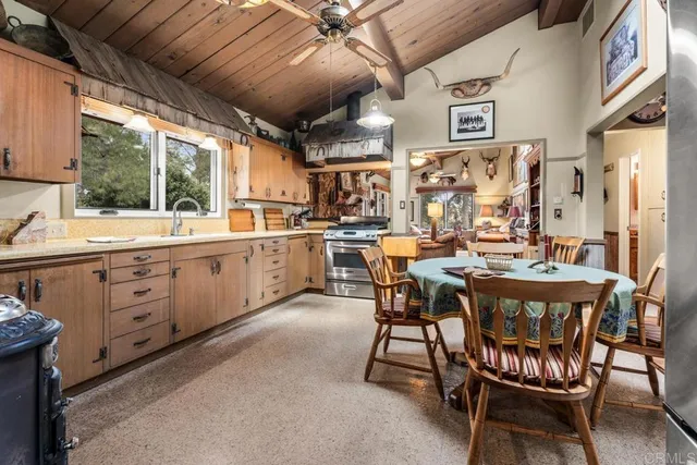 a view of a dining room with furniture window and outside view