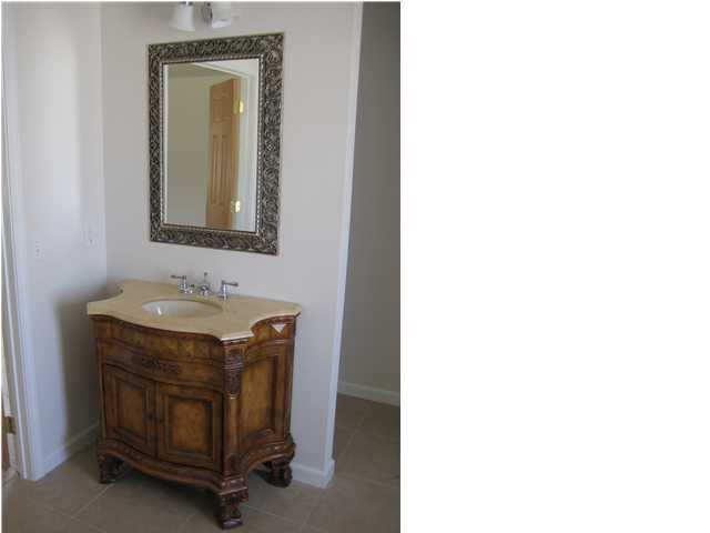 5219 Moore Loop Crestview, FL 32536 - Photo 2 of 14 a bathroom with a sink and a mirror