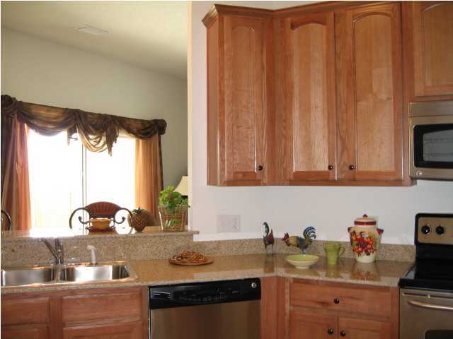 5219 Moore Loop Crestview, FL 32536 - Photo 14 of 14 a kitchen with a sink cabinets and window