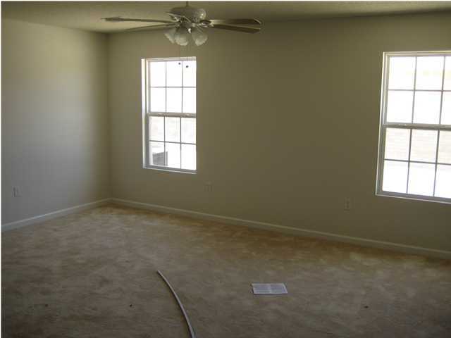 5219 Moore Loop Crestview, FL 32536 - Photo 3 of 14 an empty room with a window