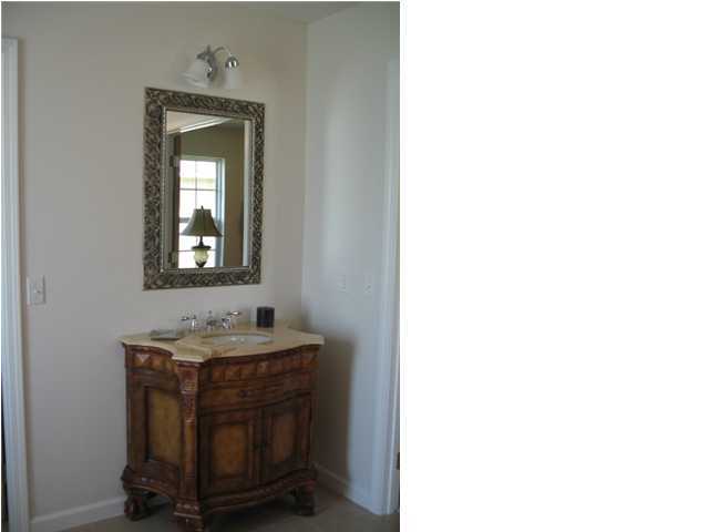 5219 Moore Loop Crestview, FL 32536 - Photo 5 of 14 a bathroom with a sink and a mirror