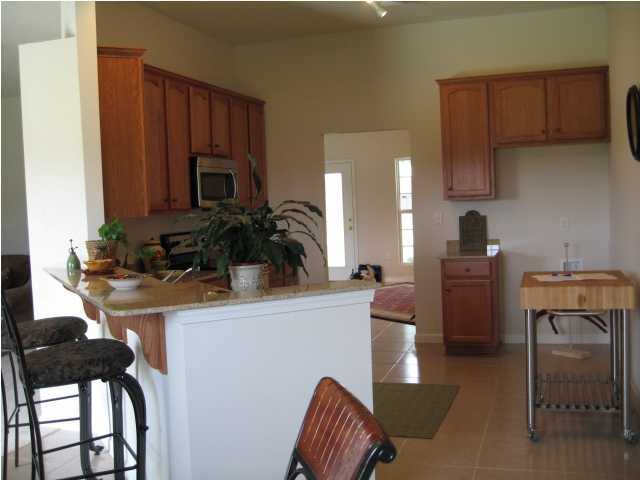 5219 Moore Loop Crestview, FL 32536 - Photo 9 of 14 a living room with furniture and a potted plant