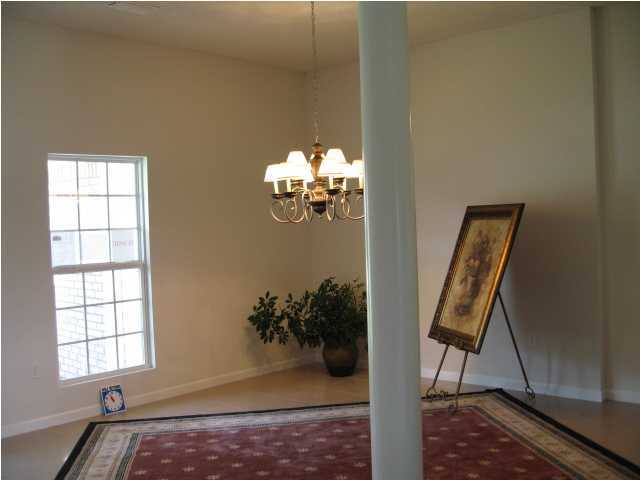 5219 Moore Loop Crestview, FL 32536 - Photo 10 of 14 a view of entryway with a flower pot and a bookshelf