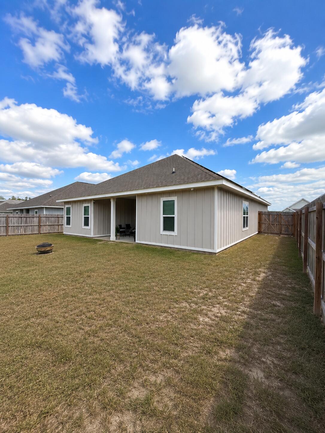734 Quintana Street Crestview, FL 32539 - Photo 16 of 16 a front view of a house with garden