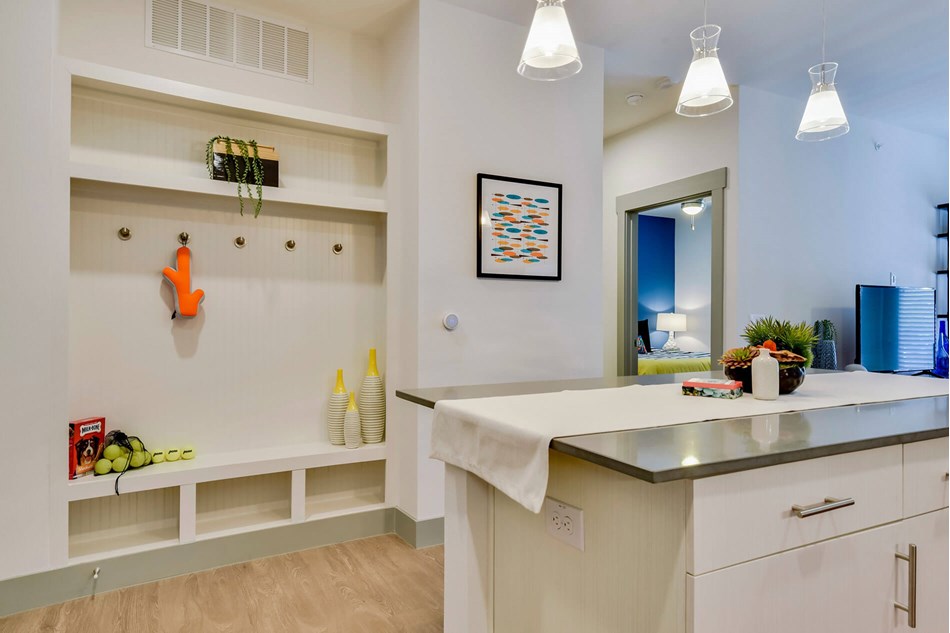 7880 Highway 290, Unit 9208 Austin, TX 78736 - Photo 4 of 9 a kitchen with a sink cabinets and wooden floor