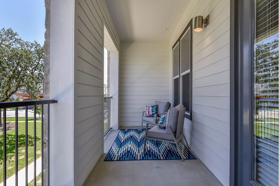 7880 Highway 290, Unit 9208 Austin, TX 78736 - Photo 7 of 9 a view of balcony with chair and tables