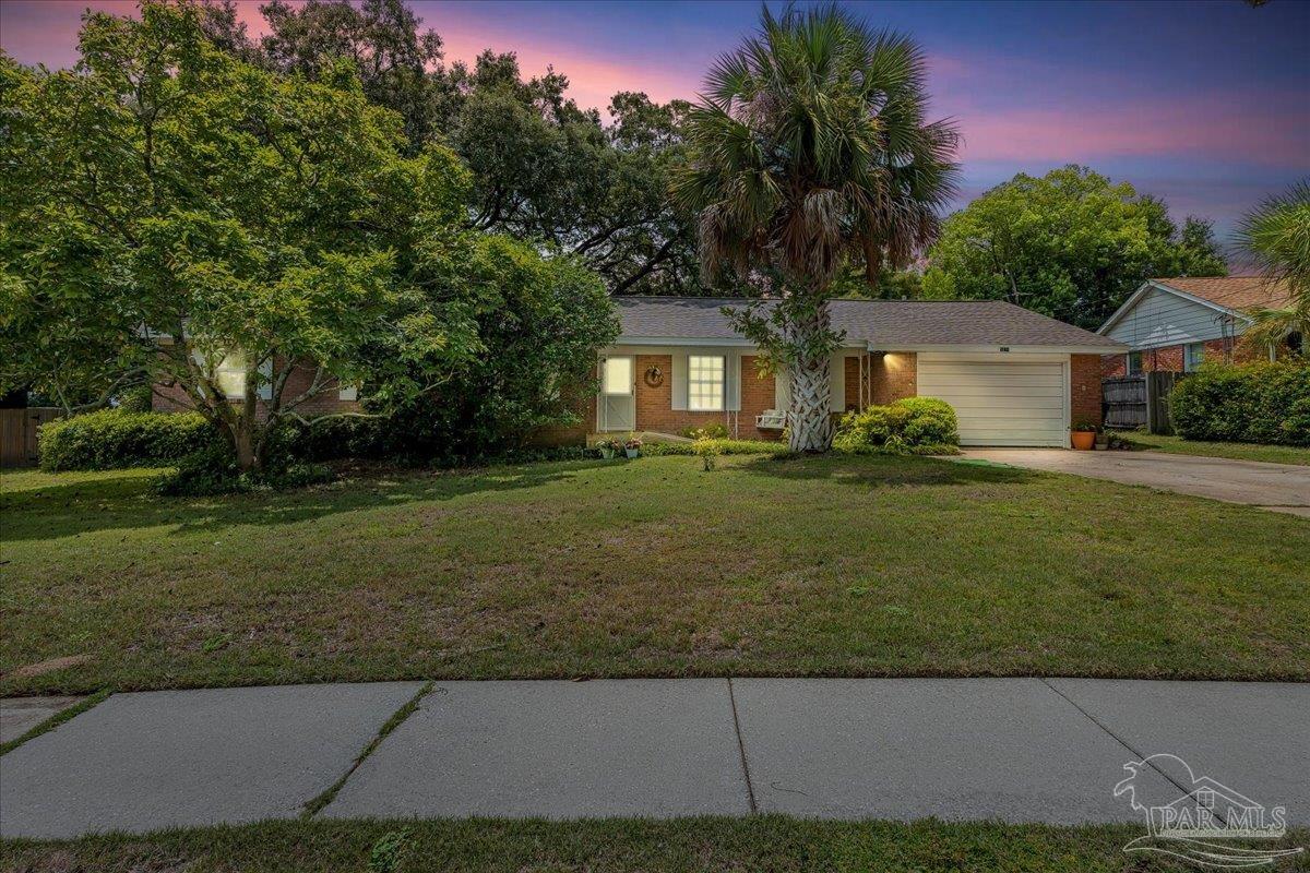2021 Morningside Drive Pensacola, FL 32503 - Photo 1 of 44 a front view of a house with a garden