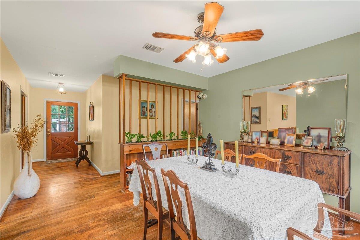 2021 Morningside Drive Pensacola, FL 32503 - Photo 21 of 44 a large kitchen with a table and chairs