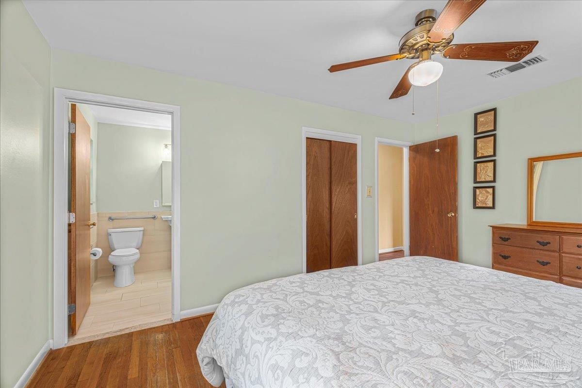 2021 Morningside Drive Pensacola, FL 32503 - Photo 25 of 44 a bedroom with a bed and a dresser